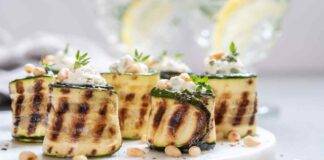 Zucchine farcite con ricotta salsicce e pinoli tostati