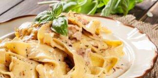 Primo di pasta con affettato e crema al formaggio e panna