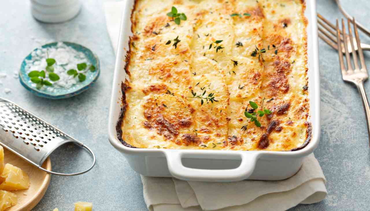 Parmigiana di patate con affettato e parmigiano