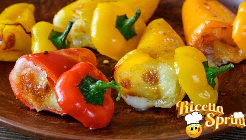 Peperoni imbottiti con prosciutto e mozzarella in padella, saporiti e