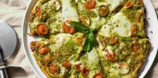 Pizza al pesto e pomodorini da condividere con gli amici a cena, sarà un gran successo