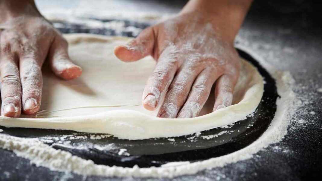 Una volta che avrai assaggiato questa pizza in teglia non desidererai