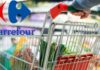 Un carrello della spesa pieno ed il logo Carrefour