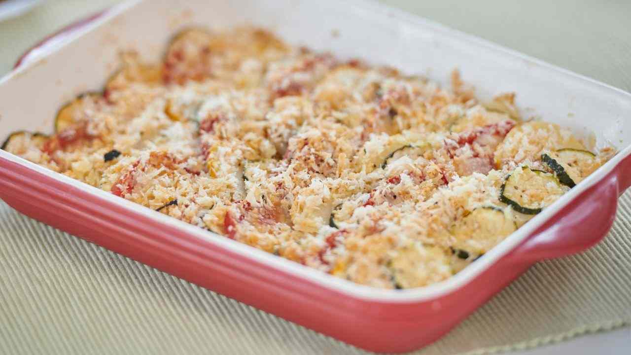 Parmigiana di zucchine con speck e provola