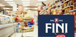 Un carrello in un supermercato ed il logo Fini