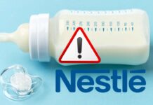 Nestlé richiama latte per bambini, l’allarme alimentare che preoccupa milioni di famiglie Biberon con latte e logo Nestlé con segnale di pericolo