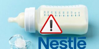 Biberon con latte e logo Nestlé con segnale di pericolo